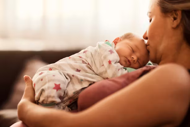 mother holding newborn baby after giving birth in a hospital in the United States