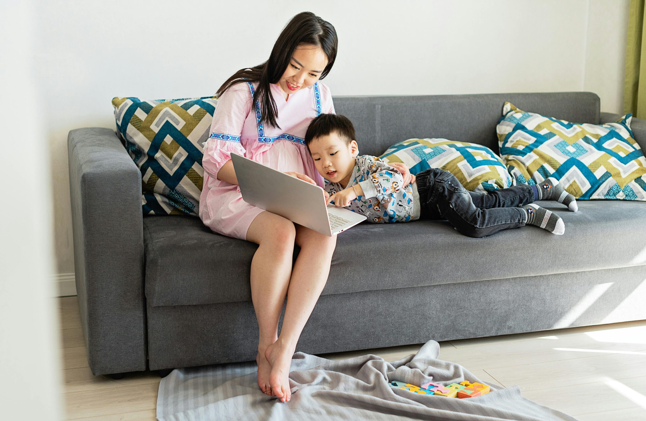 Mother and child learning together at home while navigating motherhood