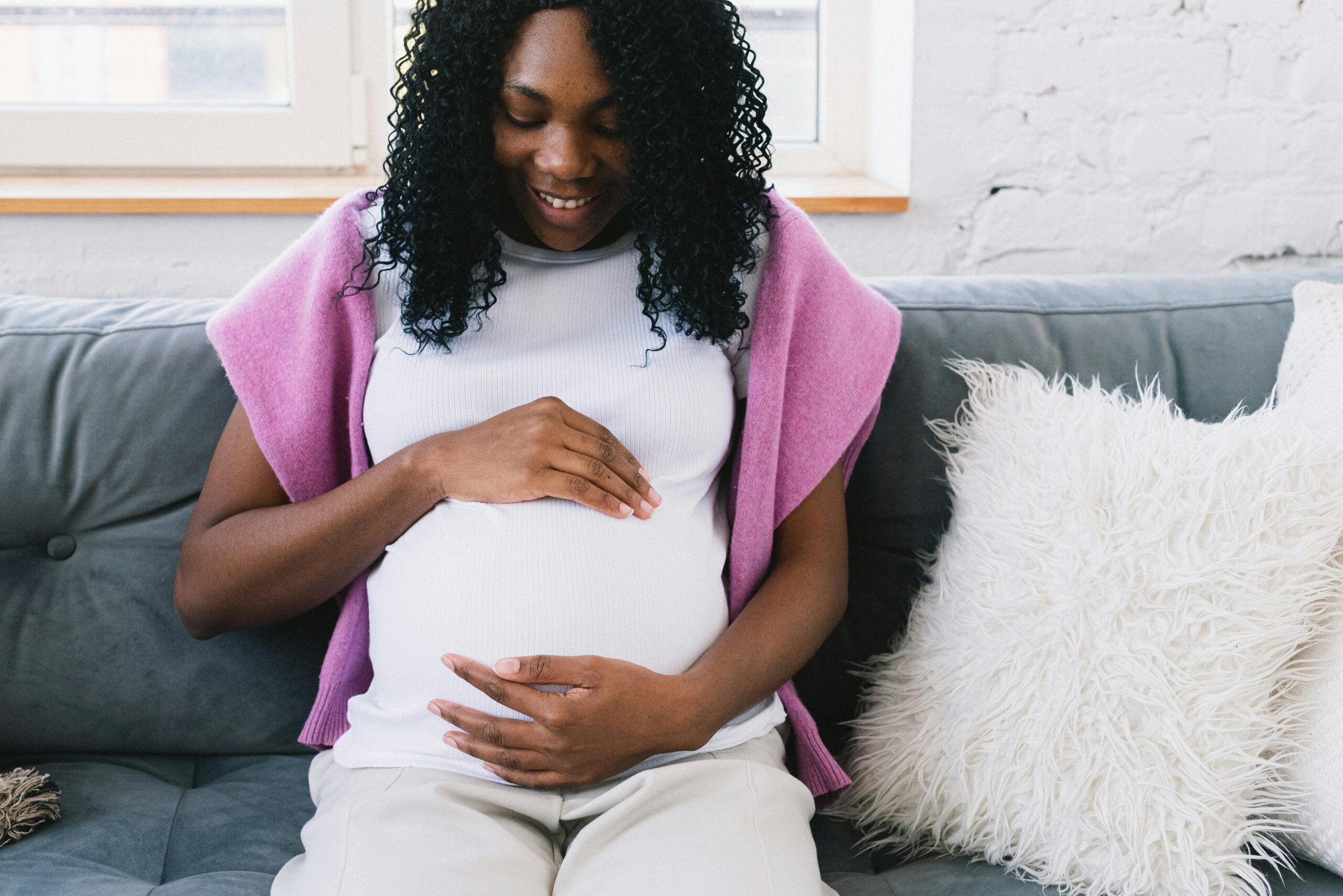 Pregnant mother preparing for motherhood while navigating pregnancy in the United States